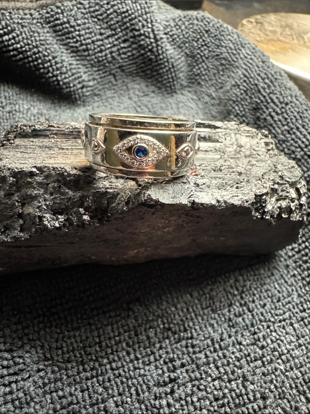 Silver Spinner Band Ring with Blue Stone Evil Eye Accent